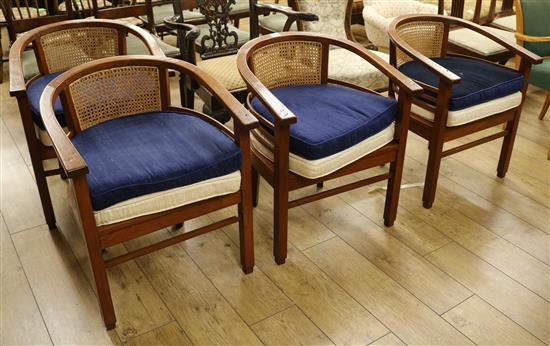 Four club chairs and two sets of silk cushions to each chair